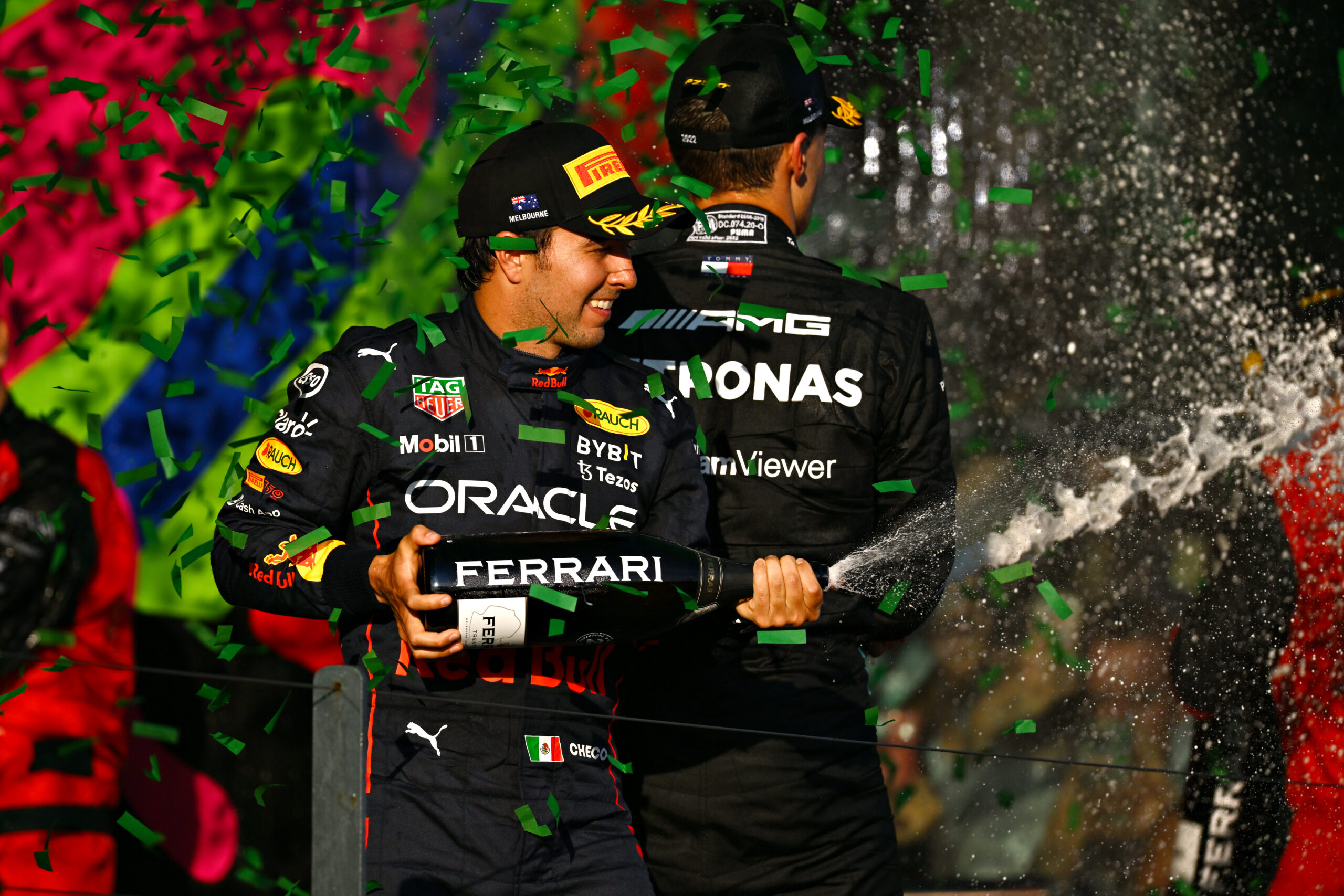 MELBOURNE, AUSTRALIA – APRIL 10: Second placed Sergio Perez of Mexico and Oracle Red Bull Racing celebrates on the podium during the F1 Grand Prix of Australia at Melbourne Grand Prix Circuit on April 10, 2022 in Melbourne, Australia. (Photo by Clive Mason/Getty Images) // Getty Images / Red Bull Content Pool // SI202204100145 // Usage for editorial use only //